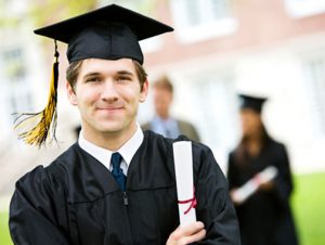 Student smiling and holding a certificate